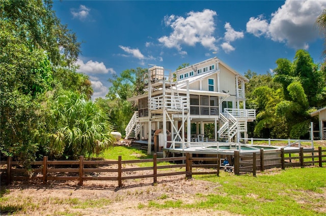 back of house with a sunroom