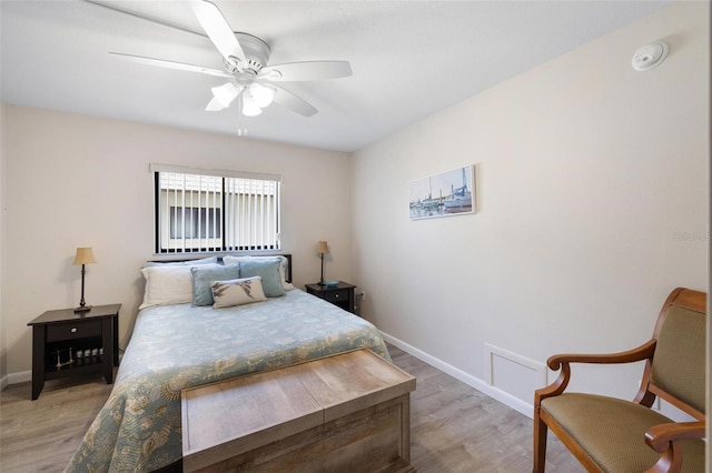 bedroom with hardwood / wood-style floors and ceiling fan