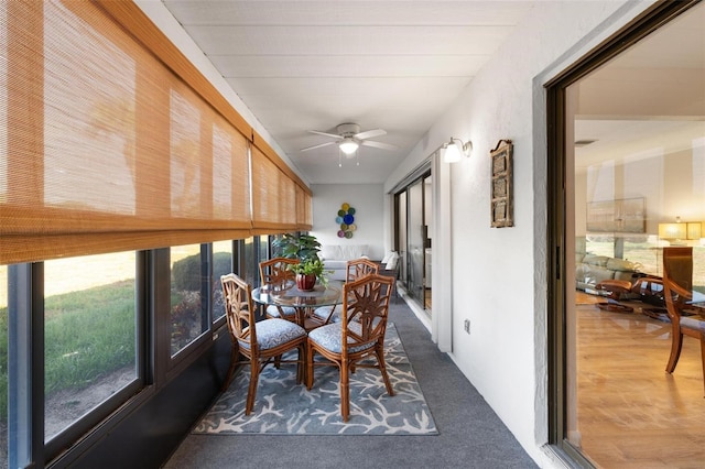 sunroom with plenty of natural light and ceiling fan