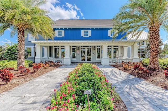 view of front of property featuring french doors and covered porch