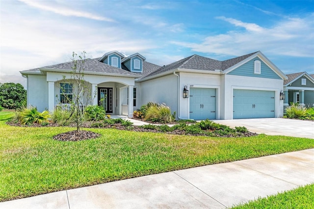 single story home featuring a garage and a front yard