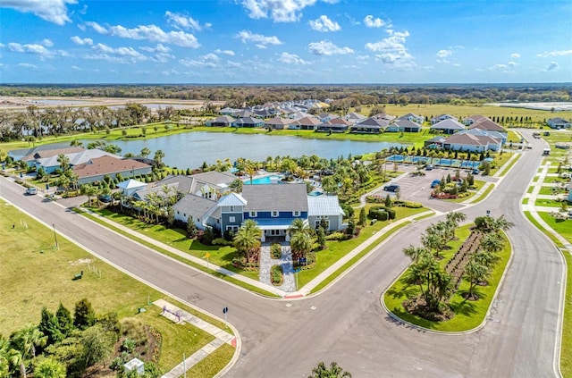 birds eye view of property with a water view