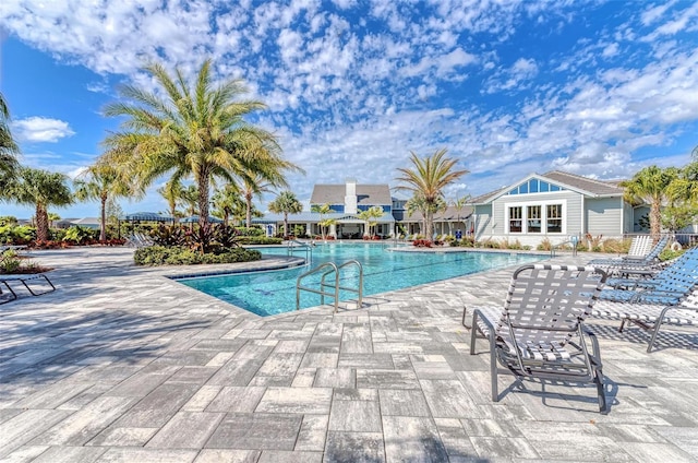 view of swimming pool with a patio area