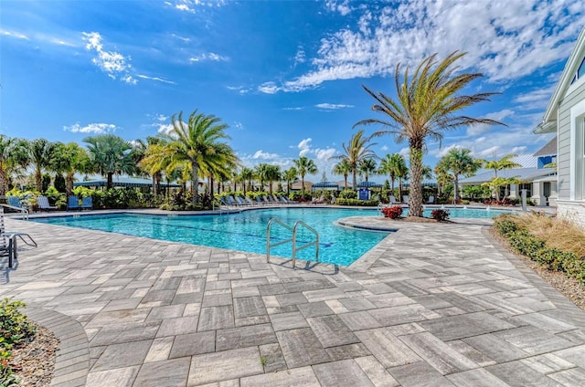 view of swimming pool featuring a patio area