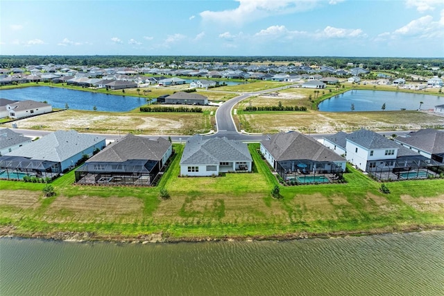 birds eye view of property featuring a water view