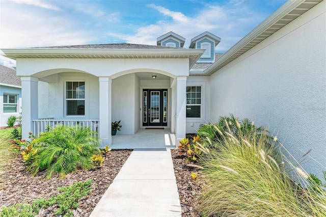 property entrance with covered porch