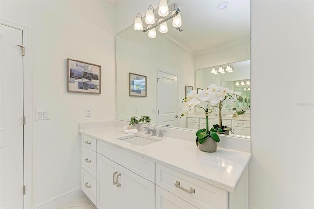 bathroom featuring vanity and crown molding