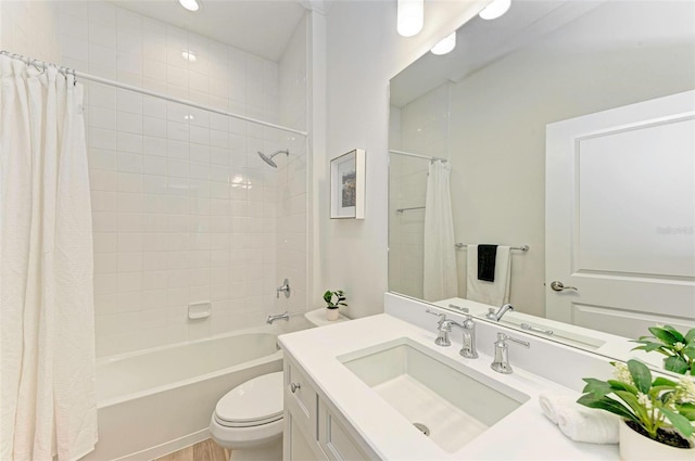 full bathroom featuring toilet, vanity, and shower / bath combo with shower curtain