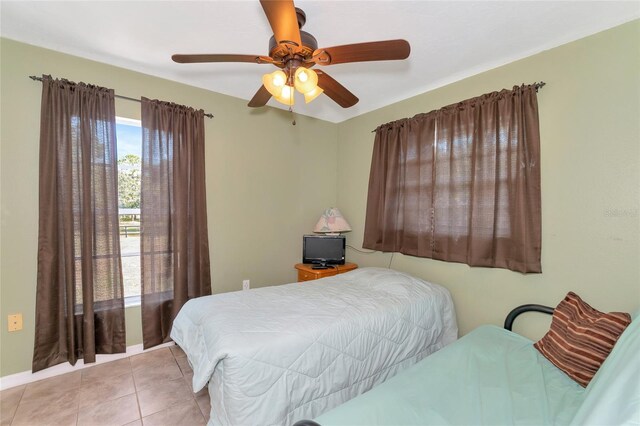 bedroom featuring ceiling fan and light tile patterned floors