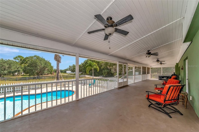 view of pool with ceiling fan and a patio