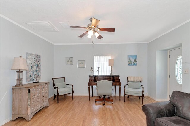 interior space featuring ornamental molding, ceiling fan, and light wood-type flooring