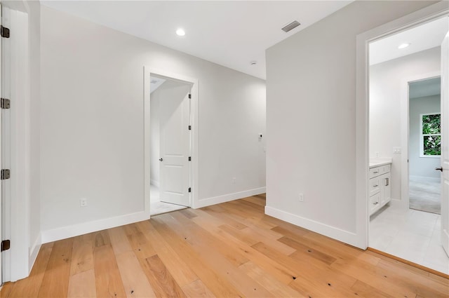 spare room featuring light wood-type flooring