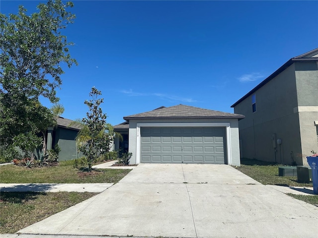 single story home featuring a garage