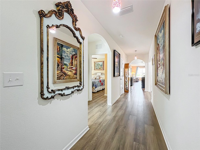 hallway with wood-type flooring