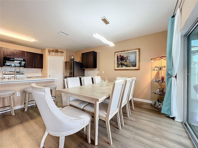 dining area featuring light hardwood / wood-style floors