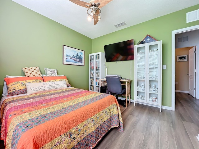 bedroom with hardwood / wood-style flooring and ceiling fan