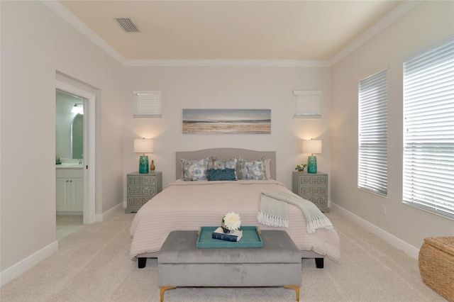 carpeted bedroom with ensuite bath, crown molding, and multiple windows