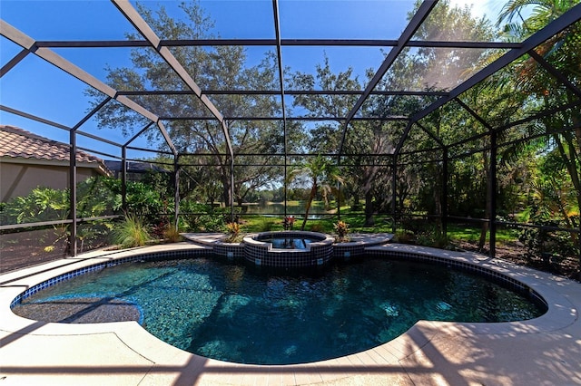 view of swimming pool featuring an in ground hot tub and a lanai