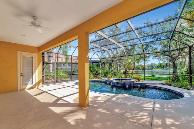 view of pool with a water view, ceiling fan, a lanai, an in ground hot tub, and a patio area