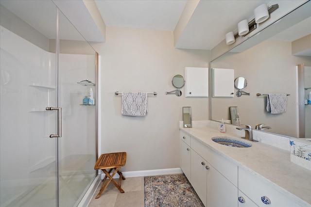 bathroom with vanity with extensive cabinet space, walk in shower, and tile floors