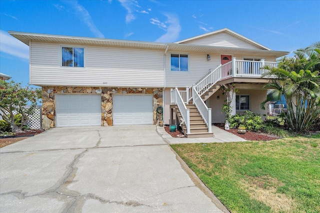 view of front facade with a front yard and a garage