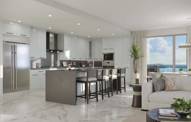 kitchen featuring built in appliances, wall chimney exhaust hood, white cabinetry, and light tile floors