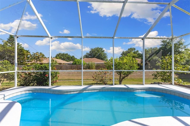 view of swimming pool with a lanai