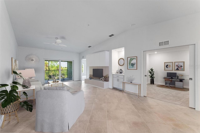 living room with light tile patterned floors, vaulted ceiling, and ceiling fan