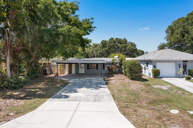 view of front of home with a front yard and a carport