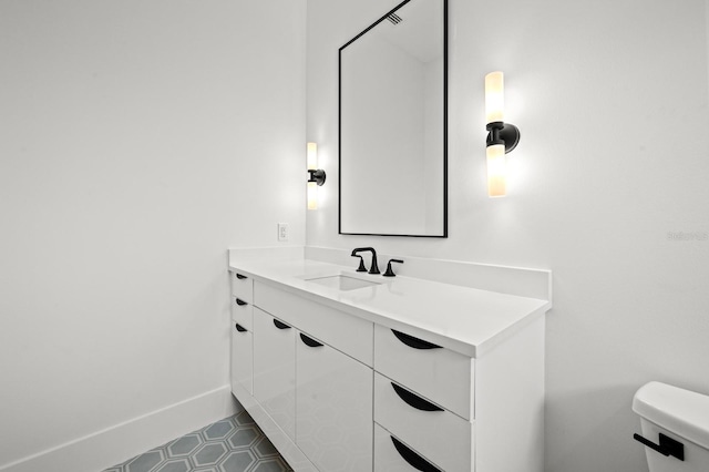 bathroom with vanity and toilet