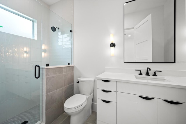 bathroom with tile patterned flooring, vanity, toilet, and an enclosed shower