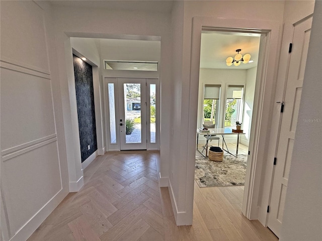 entrance foyer featuring light parquet flooring