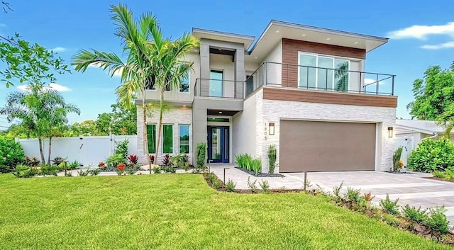 1805 Goldenrod St, Sarasota, FL 34239 - contemporary house with a balcony, driveway, stone siding, an attached garage, and fence