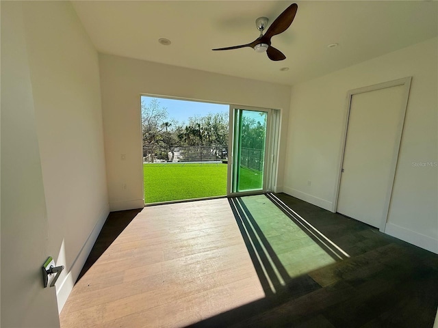 interior space with ceiling fan