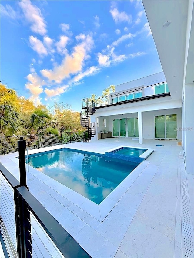 view of swimming pool with a patio area