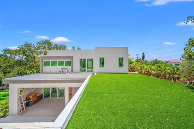 rear view of house with a lawn