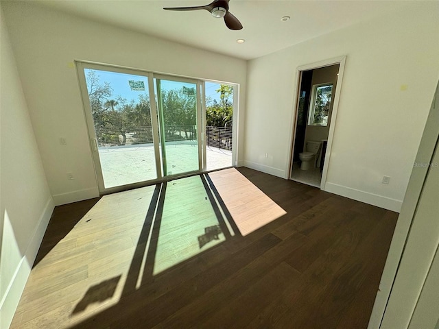 interior space featuring dark hardwood / wood-style flooring and ceiling fan