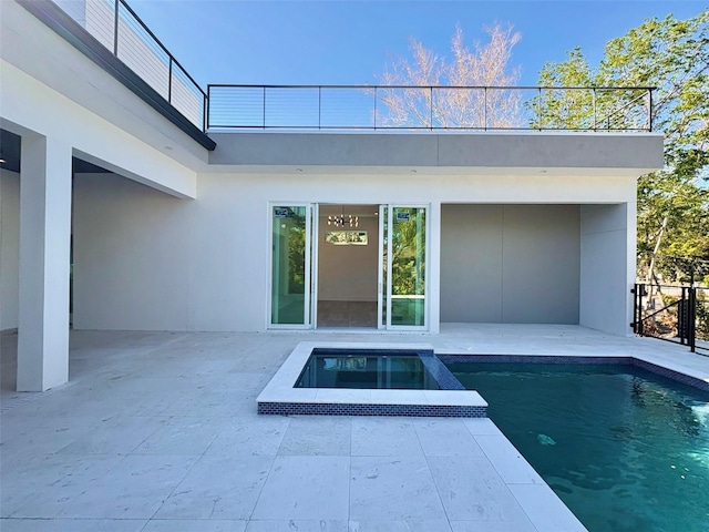 view of swimming pool with a patio area and an in ground hot tub