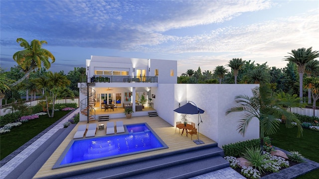 pool at dusk featuring a patio area