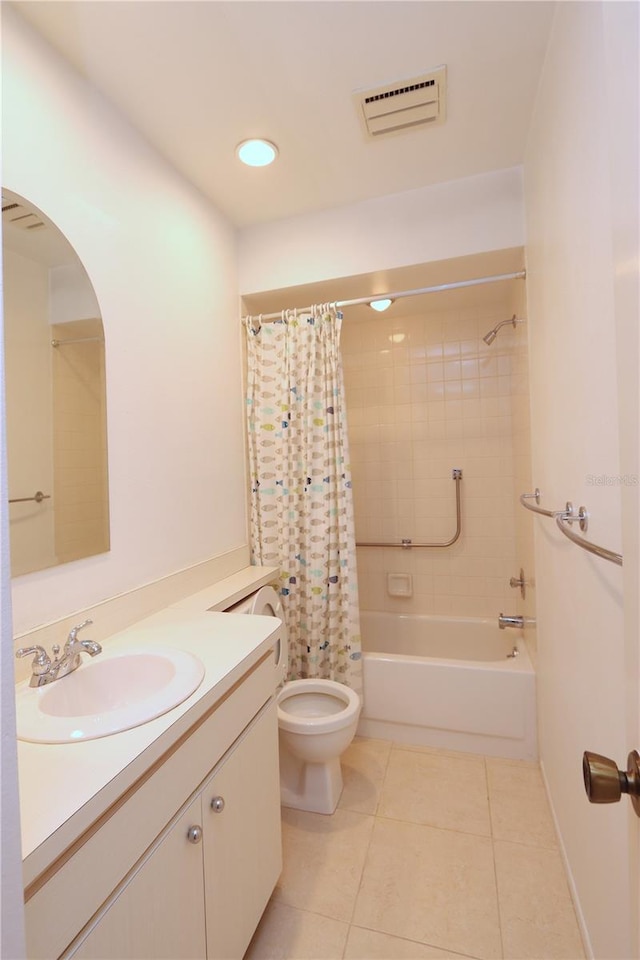 full bathroom with toilet, shower / bath combo, vanity, and tile patterned floors