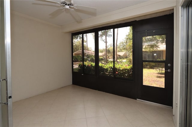 unfurnished sunroom with a wealth of natural light and ceiling fan