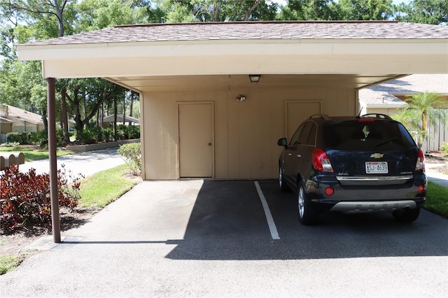 view of vehicle parking with a carport