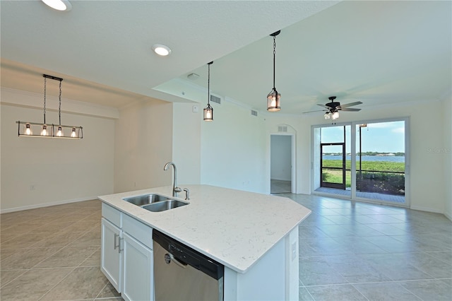 1020 Tidewater Shores Loop Unit 108, Bradenton, FL 34208 - kitchen with dishwasher, crown molding, open floor plan, light tile patterned floors, and light stone counters