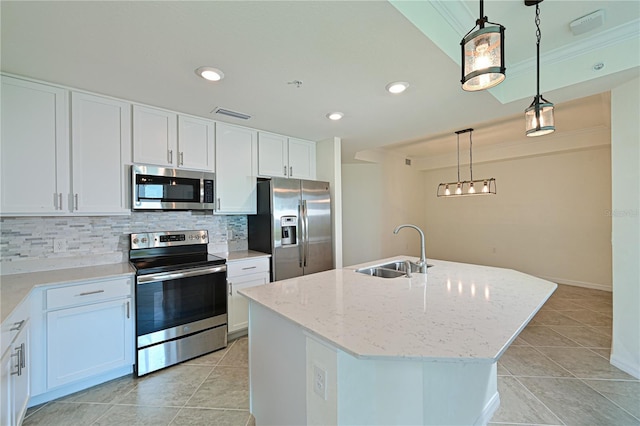 1020 Tidewater Shores Loop Unit 108, Bradenton, FL 34208 - kitchen with stainless steel appliances, backsplash, white cabinets, light stone countertops, and recessed lighting