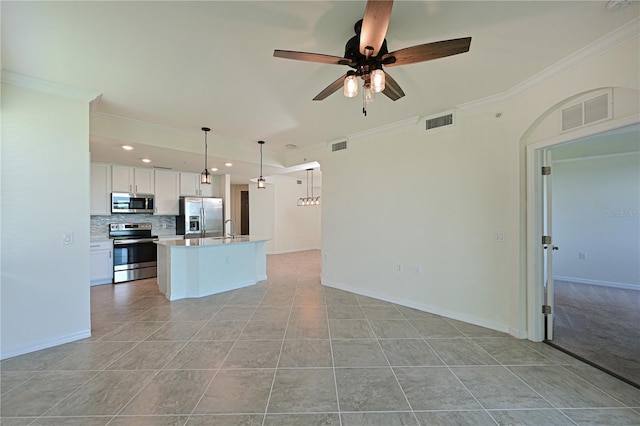 1020 Tidewater Shores Loop Unit 108, Bradenton, FL 34208 - unfurnished living room featuring a ceiling fan, light tile patterned flooring, crown molding, and recessed lighting