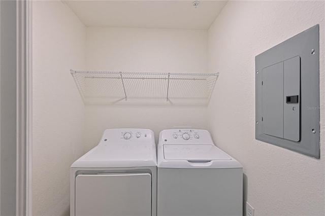 1020 Tidewater Shores Loop Unit 108, Bradenton, FL 34208 - laundry room featuring electric panel and washing machine and dryer