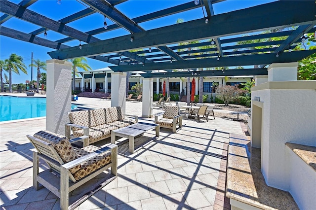1020 Tidewater Shores Loop Unit 108, Bradenton, FL 34208 - view of patio / terrace with a pergola, an outdoor hangout area, a community pool, and outdoor dining space