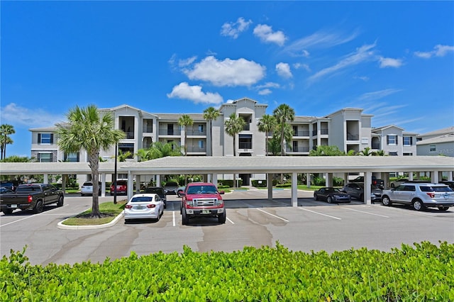 1020 Tidewater Shores Loop Unit 108, Bradenton, FL 34208 - view of property featuring covered parking