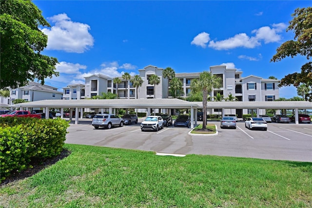 1020 Tidewater Shores Loop Unit 108, Bradenton, FL 34208 - view of property with covered and uncovered parking