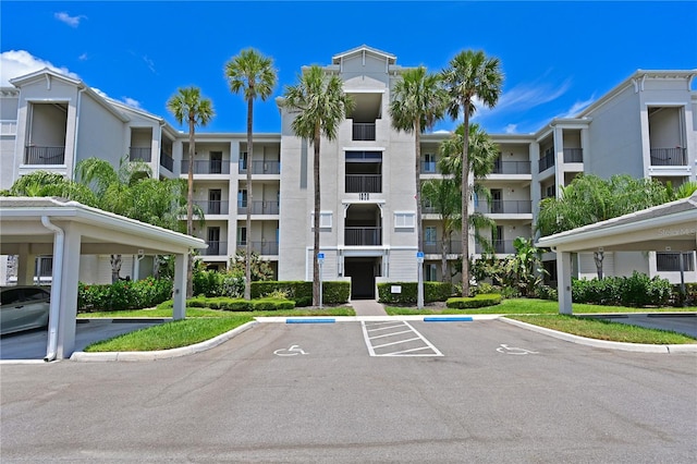 1020 Tidewater Shores Loop Unit 108, Bradenton, FL 34208 - view of apartment building / complex with uncovered parking